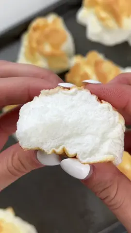 Egg White Clouds - you heard that right:) - The reason why meringue holds its shape so well is from adding buckets of sugar that coats the air that was whipped in...so this is what happens when you just add a pinchhh of sugar, but otherwise it's just egg🤷‍♀️ - Recipe: 1. Seperate the yolks out of egg whites and add to a stand mixer - I used 9 egg whites (or use carton egg whites, although this might not hold its shape so well) 2. Beat the egg whites on low for about 20 seconds then slowly increase the speed to fast - adding in about 1 tsp of sugar for 4 egg whites (1Tbsp per dozen). 3. You can add in any seasonings you'd like - I usually add salt and garlic powder, then whip until stiff peaks begin to form. 4. Scoop out individually onto an oil-sprayed baking sheet and bake in the oven for 15mins at 375F or until golden. - #Recipe #EasyRecipe #protein #dairyfree #egg 