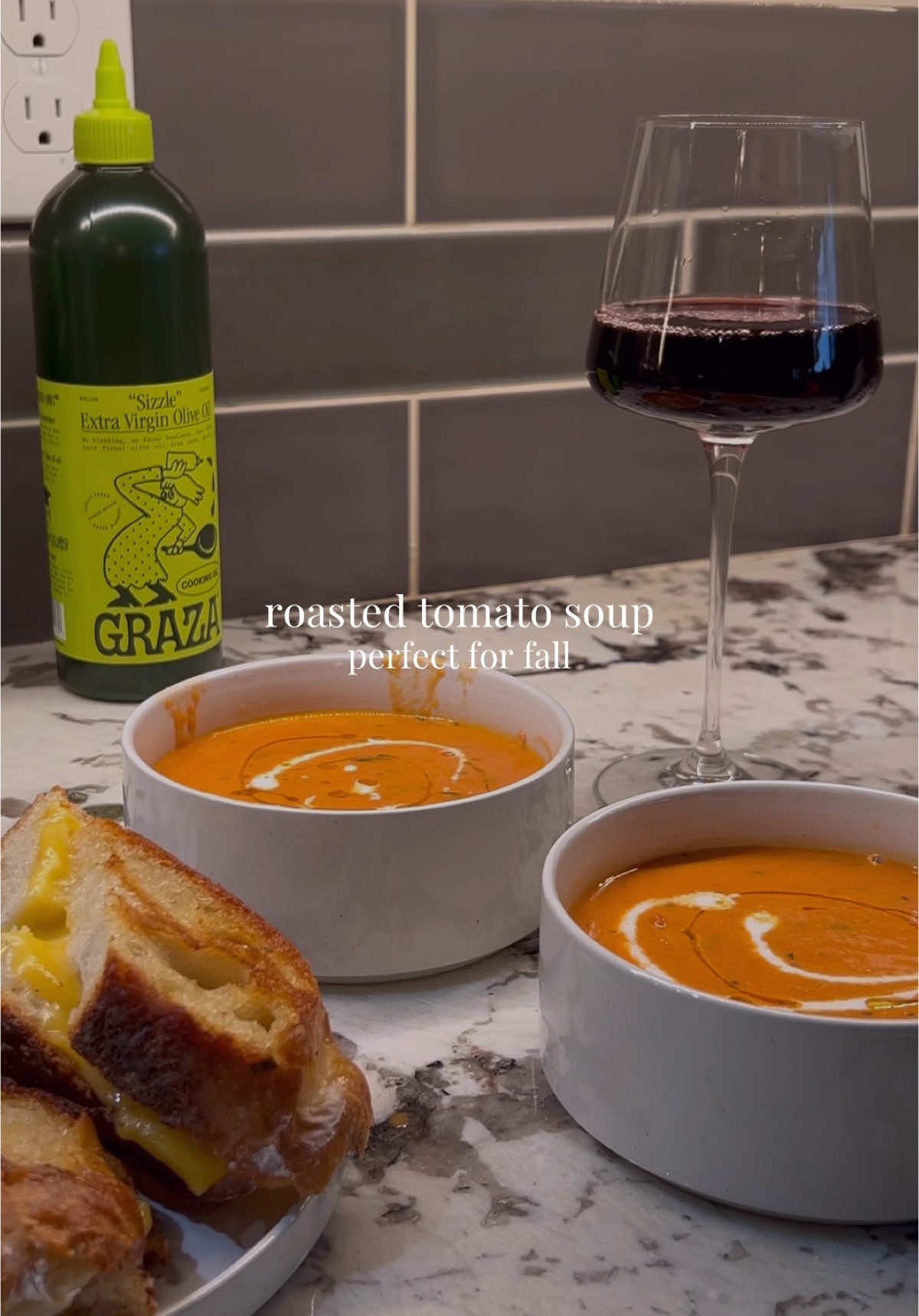 Replying to @strong & courageous  🍅🥣 Roasted tomato soup —— - In a dutch over combine a variety of tomatoes; I used about 8 Roma tomatoes, cherry tomatoes on the vine, & a can of San marzano whole tomatoes  - Add an onions; quartered - Drizzle with olive oil & season to taste  - Roast with the lid on for about 45 mins at 375 - Once 45 mins is up take out of oven & transfer roasted tomatoes to blender & blend until the consistency you like. I like mine a little more chunky. This might need to be done multiple times to get it all. Alternatively you could use an immersion blender if you are using a metal pot as opposed to a ceramic dutch oven - Transfer soup back to dutch oven, add Parmesan rind, & 1/2 cup of broth. Let simmer for about 20 mins or while you make grilled cheese.  - Turn off heat & add 1/2 cup of heavy cream  - Top with a drizzle of olive oil & a little more heavy cream - Serve with grilled cheese & enjoy!  🍅🍅🍅🍅🍅 #tomatosoup #soupseason #fallsoup #souprecipe  