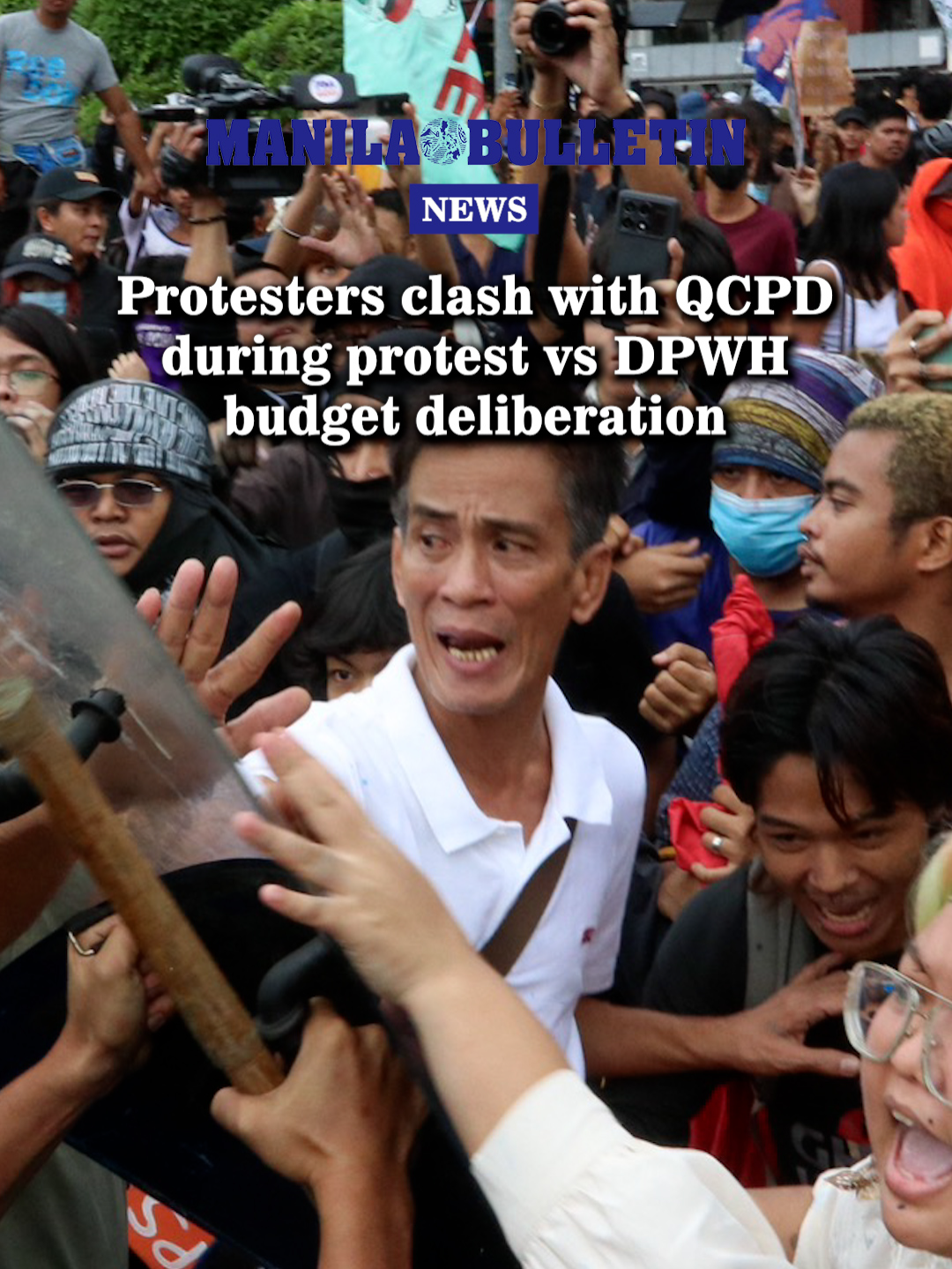 Protesters clash with members of the Quezon City Police District after throwing plastic bags with paint in a tarpaulin mimicking government project contract details which eventually hit riot police during a protest against the budget deliberation of the Department of Public Works and Highways at the House of Representatives in Quezon City on Friday, September 5. (MB Video by Santi San Juan) #MBNews #ManilaBulletin #News #NewsPH