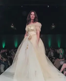 The magical details of the Tami Kay gown hardly show in this runway moment but irl the metallic embroidery and draped tulle asymmetrical arm add all the whimsy your heart desires in a ivory and peach ball gown. #kyndrajade #kyndrasangels #kansascityfashiondesigner 