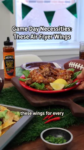 your game day wings wingman: sweet chili sauce 🏈👀 STICKY THAI CHILI AIR FRYER WINGS WHAT YOU NEED 1 lb. chicken wings, split at joints, tips removed 6 Tbsp. HEINZ Thai-Inspired Sweet Chili Sauce, divided 1 tsp. garlic salt 1/2 tsp. baking powder 1 Tbsp. sesame seeds INSTRUCTIONS PLACE wings in large resealable plastic bag. Add 1/4 cup garlic sauce; seal bag. Turn bag over several times to evenly coat wings with sauce. REFRIGERATE 30 min. to marinate. HEAT air fryer to 400°F. Remove wings from bag; discard bag and marinade. Pat wings dry with paper towels. Place wings in medium bowl. Combine baking soda and garlic salt. Add to wings; toss wings to evenly coat wings with baking soda mixture. PLACE wings in air fryer basket. Cook 12 min. or until wings are done, gently shaking wings in basket after 6 min. Let wings stand in air fryer 3 min. before transferring wings to large bowl. ADD sesame seeds and remaining sauce to wings; mix lightly. Serve. #gameday #gamedayeats