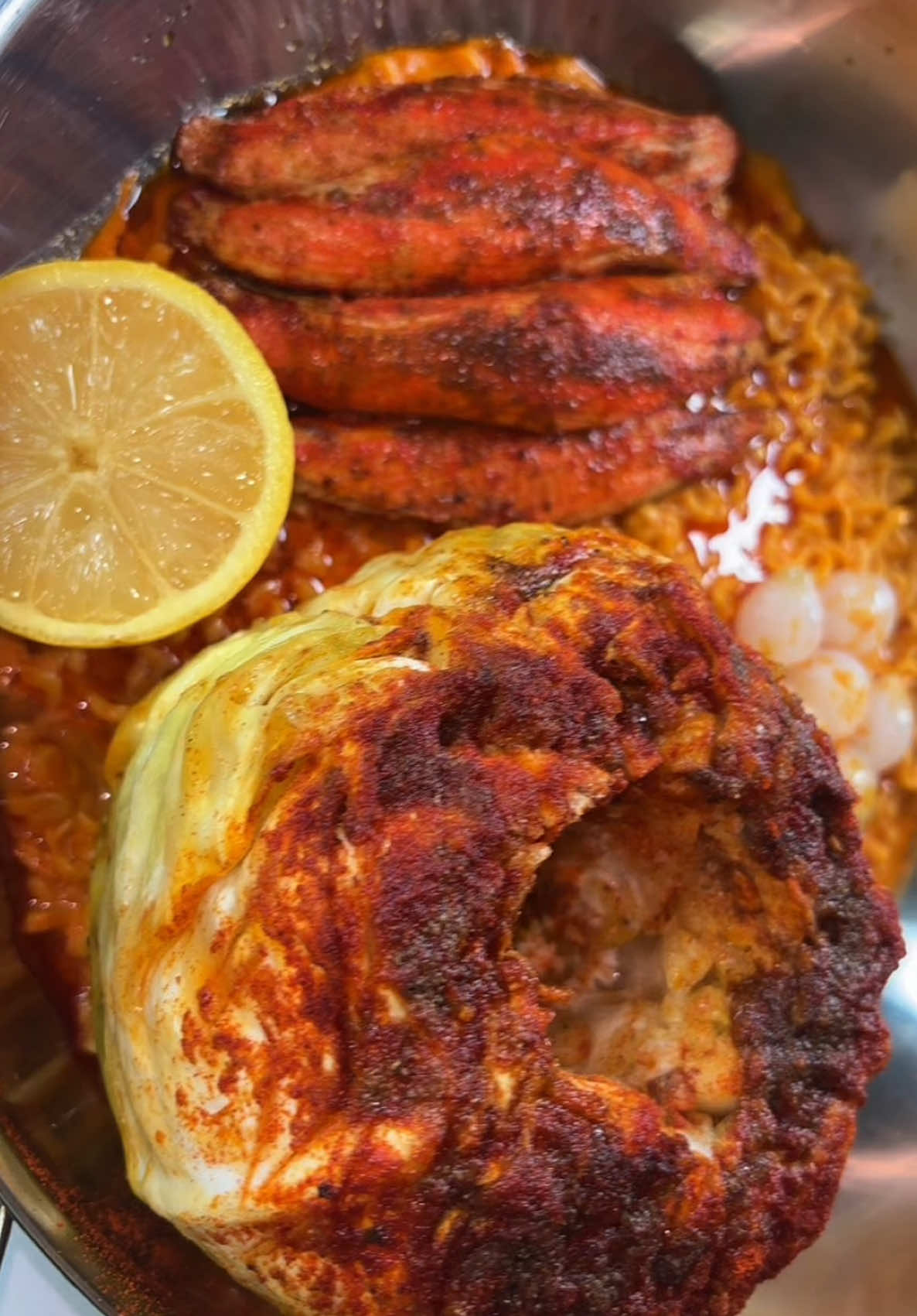 cabbage boil w/ crab, cocktail onions & spicy buldak 🍜✨🥬 IB: @Big Papa Hannah  #foryou #mukbangeatingshow #asmr #foodtiktok #fypシ゚viral  samyang ramen noodles sausage imitation crab butter sauce eating sounds foodie big bites mukbang video 
