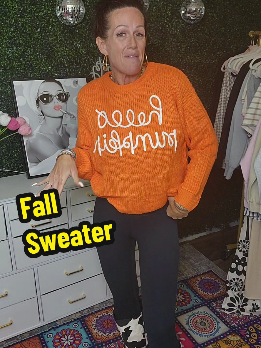 This cozy knitted pullover is the ultimate fall sweater for spooky season vibes. With its bold orange color and playful “Hello Pumpkin” design, it’s the perfect mix of cute and festive. Pair it with jeans, leggings, or even shorts for a pumpkin patch day, Halloween party, or just sipping pumpkin spice on a crisp autumn morning. The oversized, slouchy fit makes it comfy and trendy, while the knit texture gives you that classic fall aesthetic everyone’s loving this season. From cozy nights to fall festivals, this sweater is your go-to for pumpkins, hayrides, and everything autumn. #️⃣ #FallSweaterStyle #SpookySeasonVibes #PumpkinPatchOutfit #HalloweenSweater 