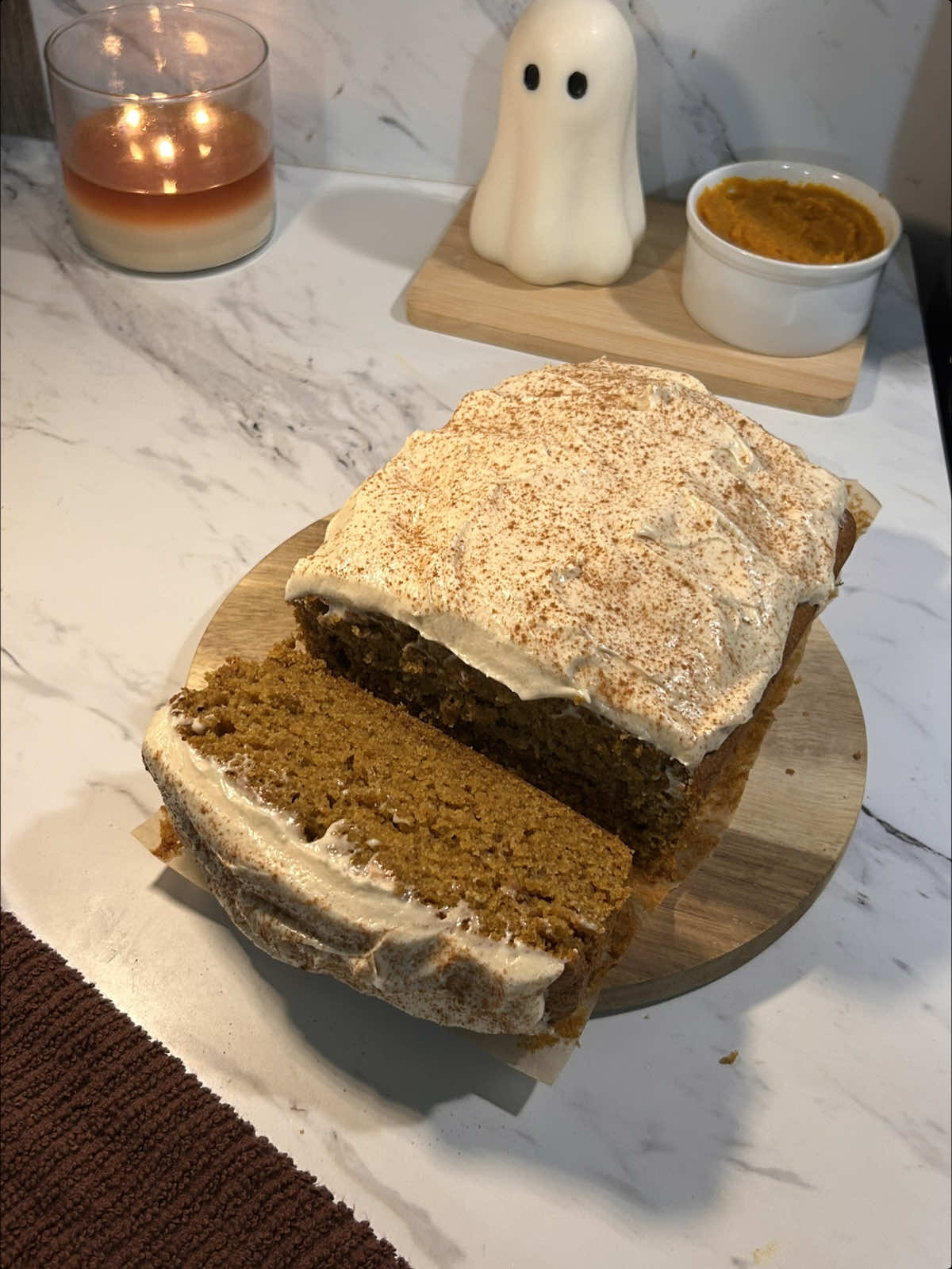 the softest pumpkin bread ever omg. it was so fluffy & the maple cream cheese frosting was perfect!!      recipe: 1¾ cups all-purpose flour (210g) 1 tsp baking powder (5g) ½ tsp baking soda (2g) ½ tsp salt (2g) 2 tsp cinnamon (5g) ½ tsp nutmeg (1g) ¼ tsp cloves (0.5g) ¼ tsp ginger (0.5g) ½ cup granulated sugar (100g) ½ cup brown sugar, packed (100g) ½ cup neutral oil (120ml) 2 eggs, room temp (100g) 3/4 cup pumpkin purée, not pumpkin pie filling (180g) 1 tsp vanilla extract (5g) ¼ cup milk, room temp (60ml)   instructions:   preheat oven to 325°f (165°c). in one bowl whisk together flour, baking powder, baking soda, salt, cinnamon, nutmeg, cloves, and ginger. in another bowl whisk together sugar, brown sugar, oil, eggs, pumpkin purée, vanilla, and milk until smooth. add dry ingredients to wet and fold in gently until just combined, don’t overmix. pour into a lined loaf pan and bake for 55–65 minutes, or until a toothpick inserted in the center comes out clean. let cool before frosting. ( if you have a glass pan i reccomend setting it on a light tray to prevent the sides & bottom from cooking too fast, this is common with glass pans. )       maple cinnamon cream cheese frosting:   8 oz softened cream cheese(226g) 4 tbsp softened butter(57g) 2-3 tbsp maple syrup(30-45g)(adjust to taste)  ½ tsp cinnamon(1g)(optional but i love cinnamon) 1 ¼–1 ½ cups (150–180g) powdered sugar, sifted  1 tsp vanilla bean paste    beat cream cheese and butter until fluffy. add maple syrup, vanilla, and powdered sugar. whip until smooth and thick enough to spread . ( add more powdered sugar if you want it thicker )( i had a little left over so feel free to half the recipe!) #pumpkinbread #pumpkin #fallbaking #Recipe #pumpkindessert