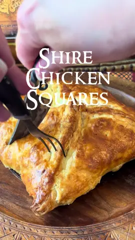 Shire Chicken Squares 🏡✨ A Hobbit-worthy puff pastry filled with creamy chicken, veggies, and smoked Gouda—perfect for second breakfast (or elevenses). Recipe: 1 cup diced cooked chicken ½ cup carrots, diced ½ cup celery, diced ½ cup onion, diced 2 tbsp cream cheese ½ cup shredded smoked Gouda 1 tsp Dijon mustard ½ tsp thyme Salt & pepper to taste 1 sheet puff pastry, cut into squares 1 egg (for egg wash) Steps: Sauté carrots, celery, and onion until soft. Add chicken, mustard, thyme, salt, and pepper. Stir in cream cheese & smoked Gouda until melty and combined. Spoon filling into puff pastry squares. Fold & seal edges. Brush with egg wash. Bake at 400°F (200°C) for 20–25 min, until golden. Serve hot, straight from the Shire! 🌿🥕🧀 #lotr #lordoftheringsfood #chickensquares #hobbitfood #hobbitcore 