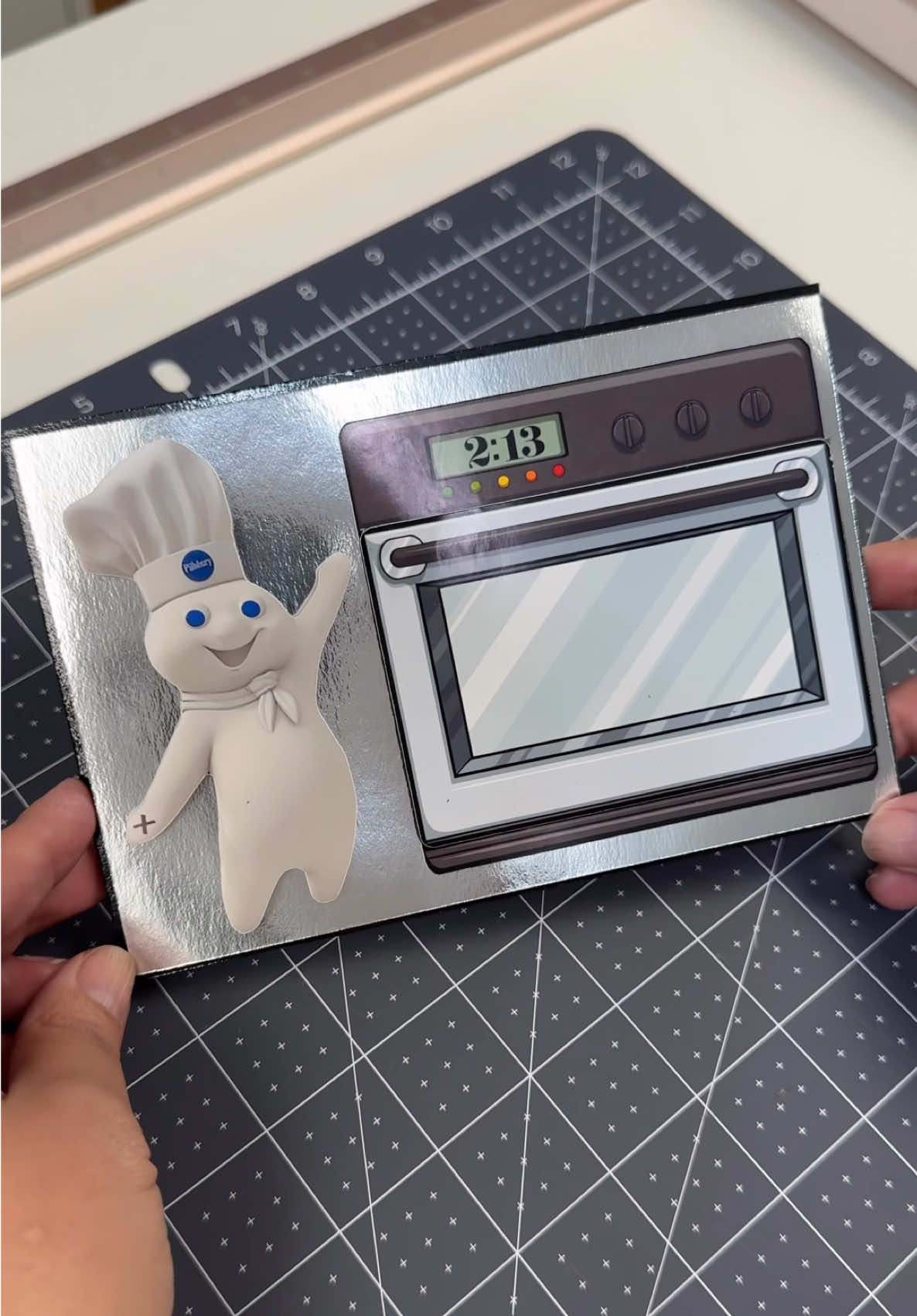 🎂✨What are you crafting up this weekend? ✂️💕 Yesterday I made this card for a family friend, actually, a bandmate of my husband. This card has quite a few nods to their band, Apartment 213 (the time on the oven clock) and his previous band Pillsbury Hardcore (the straight edge doughboy). I had the vision and ran with it!! Magnets, springs, layers, acetate, and of course the doughboy! I used: @KoalaPaper photo paper @Bearly Art precision glue @Michaels Stores acetate and cardstock  & @Cricut to make it come to life! #customcards #cricut #birthdaycard #cardmakingideas #craftersoftiktok 