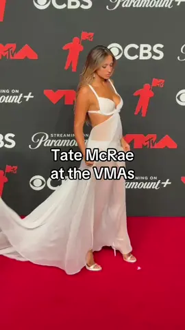 Forever putting the ate in Tate. Tonight, #TateMcRae stepped out in a custom white #ludovicdesaintsernin gown for the 2025 #VMAs.