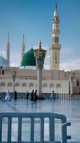 This image captures the majestic beauty of Masjid al-Nabawi, the Prophet's Mosque, located in the holy city of Madina. The iconic green dome marks the resting place of the Prophet Muhammad (PBUH). Surrounded by elegant minarets, the mosque's stunning architecture is illuminated under a clear blue sky. The expansive marble courtyard reflects the soft sunlight, creating a serene and spiritual atmosphere. Pilgrims are seen peacefully walking and praying, symbolizing the unity and devotion of Muslims from around the world. This sacred site is not only an architectural masterpiece but also a place of deep reverence and tranguility. #unfrezzmyaccount #viral #trading #naatstatus #mashallah #foryou #unfreez 