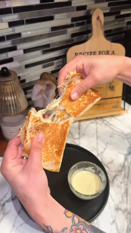 These crockpot chicken quesadillas were a hit! When I say this took NO effort and turned out so yummy!! All jokes aside, did you see how big that chicken breast was??? #chickenquesadilla #texmexfood #crockpot #crockpotrecipes #quickrecipes 