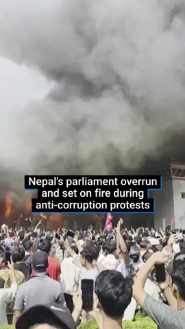 Video posted on social media shows Nepal's federal parliament building in Kathmandu on fire, after protesters stormed it as they celebrated the resignation of Prime Minister K.P. Sharma Oli. At least 19 people in two cities died in Nepal's worst unrest in decades, as police in the capital fired tear gas and rubber bullets at protesters trying to storm parliament in anger at corruption and an attempted social media shutdown. Oli took over as prime minister of Nepal for the first time in October 2015. Despite his resignation, protesters continue to rally on the street, with some of them scaling buildings, including the offices of the ruling party, as plumes of smoke billowed across the city. #news #nepal #worldnews