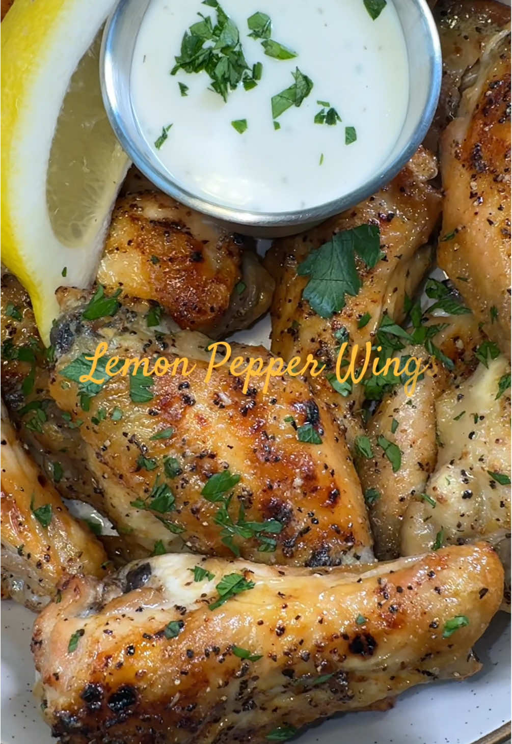 Save this for your next Game Day 🏈 Game 1: Lemon Pepper Wings Prep the wings:  Pat dry and season with salt, pepper, and lemon pepper seasoning. Bake: Place the wings on a wire rack and cook for around 50 minutes on 425 degree F.  Flip wings halfway through cooking. Sauce: In a bowl add butter, lemon pepper seasoning, and a squeeze of lemon.  Toss the cooked chicken in the bowl coat well.   Garnish with parsley, lemon, and a dipping sauce of your choice. #gamedayfood #lemonpepperwings #wingsrecipe #footballisback #footballappetizers 