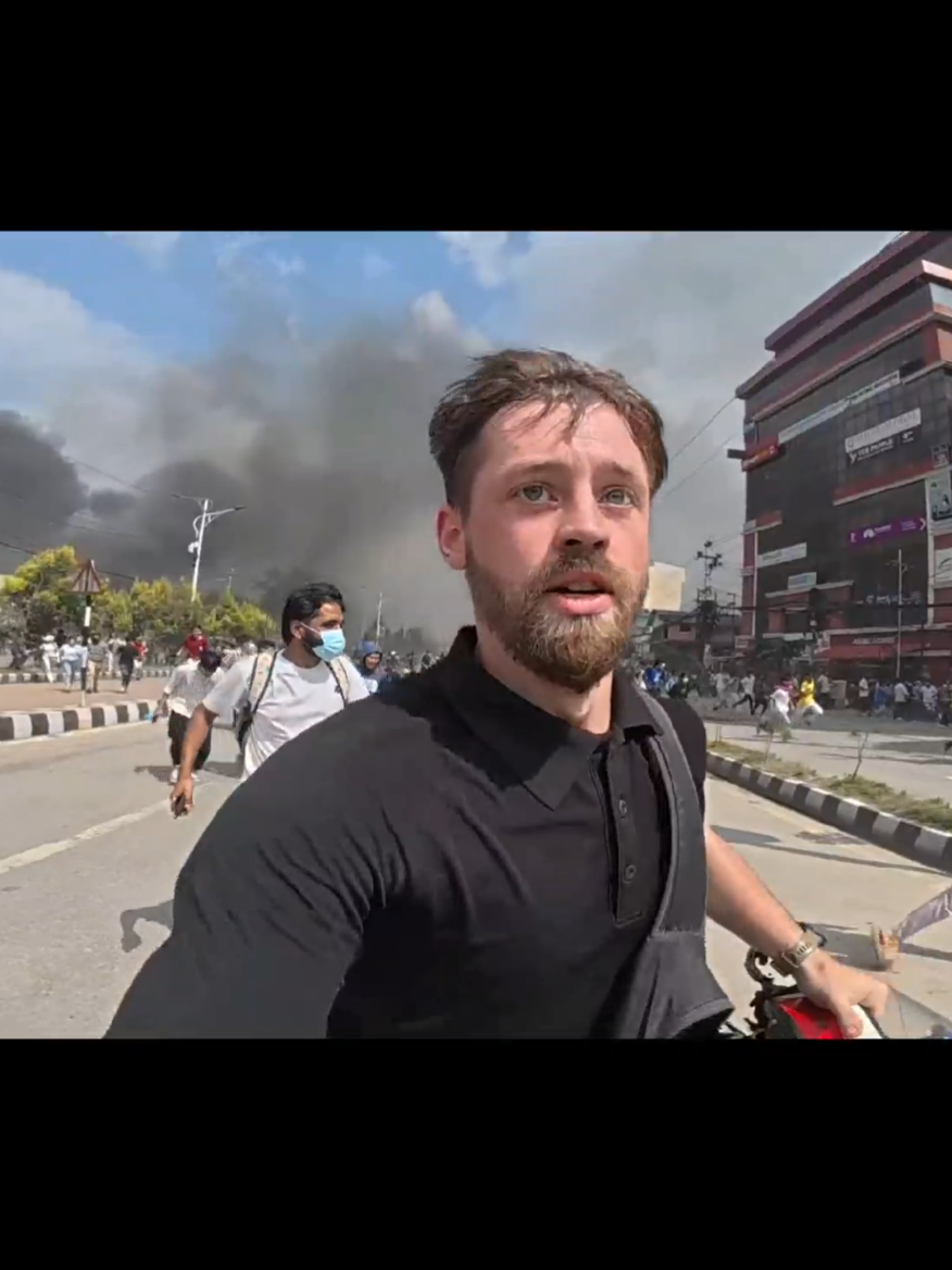His first and last time in nepal 🇳🇵.  Tourist on nepal protest.Bro almost cook from nepali's people.Nepali maandolan ma bidashi.#protest #corruption #foryoupage #creatorsearchinsights #genz 