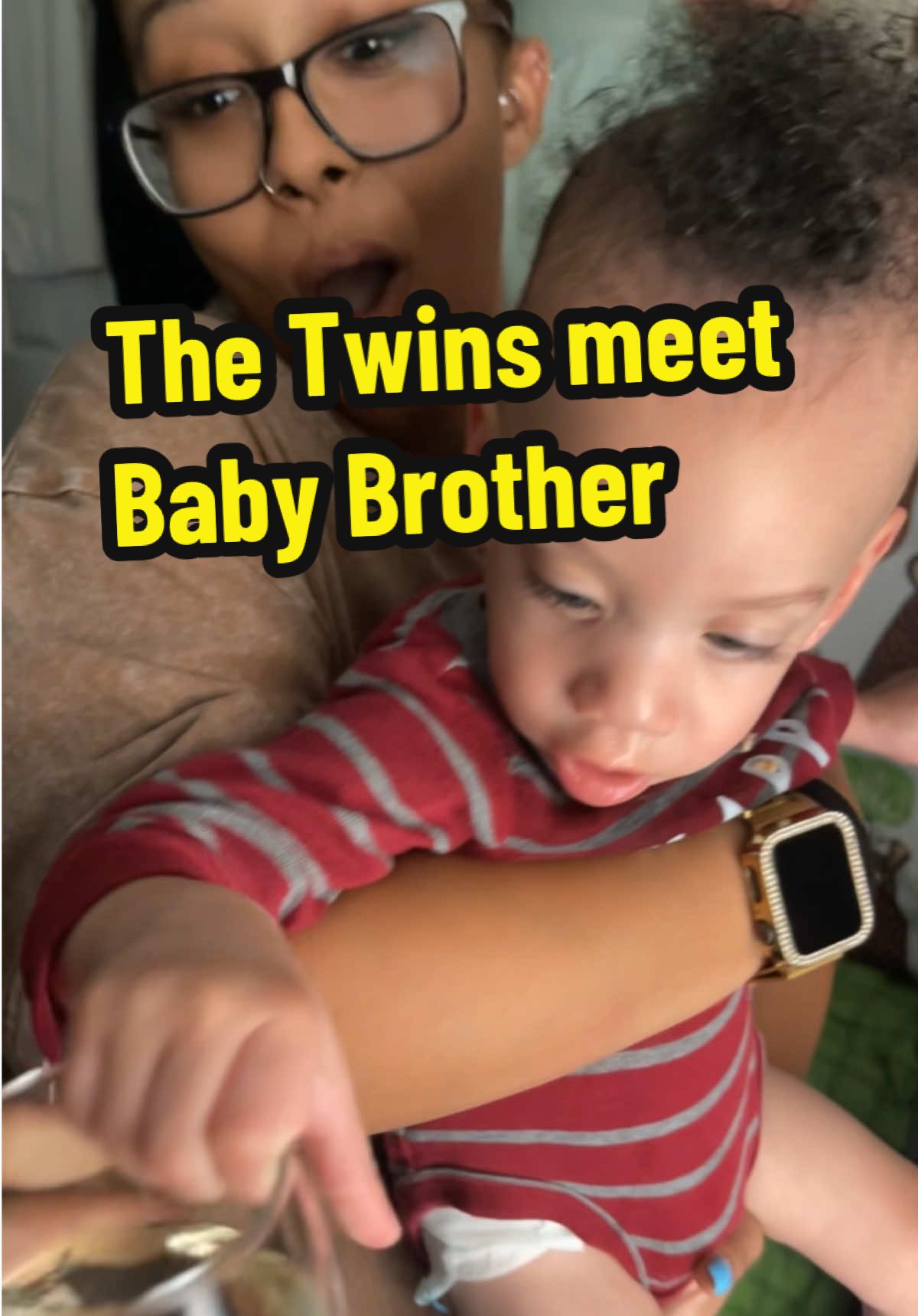 Twins meet baby brother for the first time. 