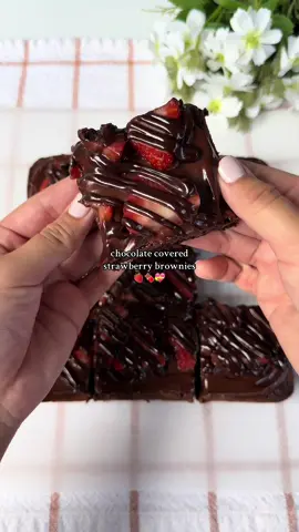 Chocolate covered strawberry brownies 🍓🍫 Recipe makes an 8x8 pan (9 large slices) Ingredients: 10 tbsp (140g) melted unsalted butter 1 cup (200g) granulated sugar ¼ cup (50g) brown sugar, packed  2 eggs, room temp 1 tsp vanilla extract ½ cup + 2 tbsp (56g) unsweetened cocoa powder 1 tbsp (13g) vegetable oil ½ tsp salt ½ tsp espresso powder (optional) ½ cup (63g) all purpose flour, spooned & leveled or weighed (don't pack it in) 1 cup (170g) chocolate chips/ chunks Topping: strawberry slices, patted dry (as many as you want/enough to cover the top) 6 oz (170g) semisweet chocolate 85 mL (~little more than ⅓ cup) heavy cream 1 tbsp (15g) unsalted butter (room temp or softened) Instructions: Preheat oven to 325°F (163°C) and line/ grease an 8x8-inch pan. In a large bowl, whisk melted butter, granulated sugar, and brown sugar until smooth. Add eggs and vanilla, then whisk vigorously for 1-2 minutes to help create a crackly top. Stir in cocoa powder, salt, and optional espresso powder until fully combined. Mix in oil, then gently fold in the flour until just combined (don't over mix). Fold in chocolate chips/chopped chocolate. Spread into the greased pan. Bake for 30-40 minutes, until a toothpick near the center comes out with moist crumbs (not wet batter). Let the brownies cool completely. Heat the cream until just simmering. Pour over chocolate, wait 1-2 min, and stir until smooth. Stir in butter until melted and glossy. Save about ⅓ of this ganache at room temp for the drizzle. Chill the remaining ganache until firm, then whip it a bit until fluffy. Frost the brownies, add the strawberry slices all over the top, and drizzle with the saved ganache. Chill before slicing to get cleaner cuts (i didn’t want to wait 😅) chocolate and strawberries make the best flavor combo! #bakingrecipe #brownies #fudgybrownies #chocolatestrawberries #bakingszn 