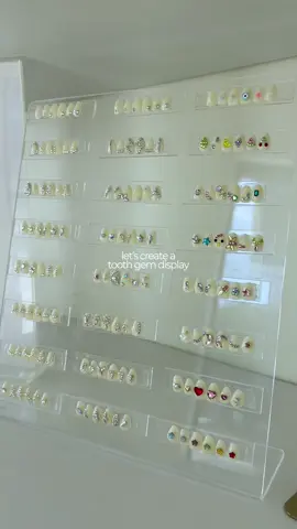 🦷💎 tooth gem heaven, right on display! 🪽 I put together a cute little display filled with all my favorite designs, sizes, and fun styles so our clients can see them up close while they wait~ or decide which gem set to go with 😍 PS: Opals are coming soon…stay tuned for the new addition to our gem collection! 🌟 💬 Comment GEMS for all the 🔗’s to the products in this video, including the stand, teeth, and more straight to your DMs! 💌 Book online, DM, text to book an appointment ⤵️ 📲 647-458-9288 🛍 Teeth Whitening & Tooth Gem Supplies 👉 ISLANDSMILESTEETHWHITENING.CA ✨ 🎓 Contact Us for training inquiries! . . #teethwhitening #torontoteethwhitening #teethwhiteningtech #teethwhiteningtraining  #islandsmiles       
