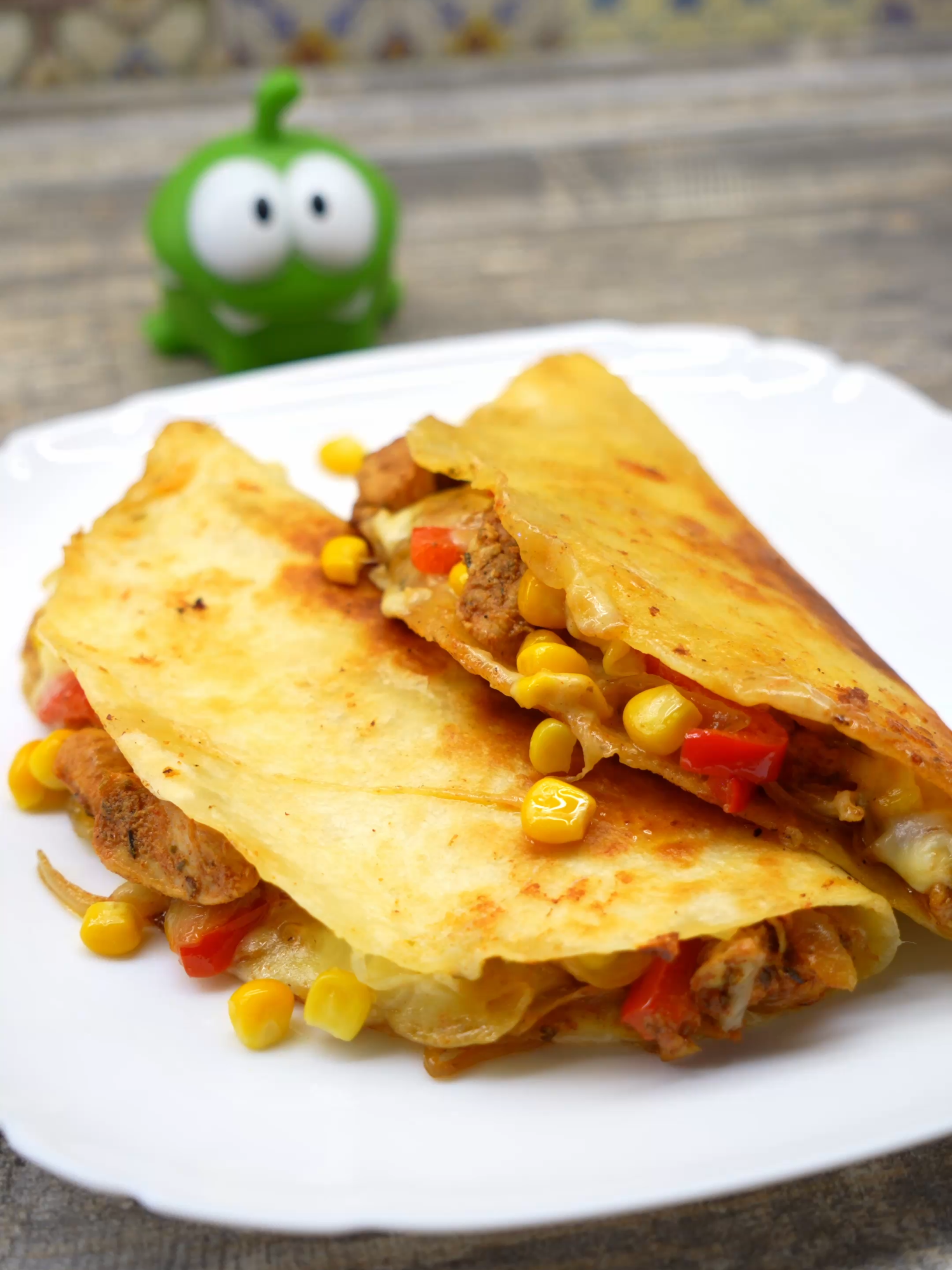 Chicken Quesadilla Recipe 🌮🧀 Filling: Chicken breast — 800 g (1.75 lbs) Vegetable oil — 2 tbsp Paprika — 1/2 tsp Chicken seasoning — 1/2 tsp Black pepper — 1/4 tsp Chili powder — 1/4 tsp Dried parsley — 1/2 tsp Dried thyme — 1/2 tsp Dried oregano — 1/2 tsp Lemon juice — 2 tbsp BBQ sauce — 1 tsp Soy sauce — 3 tsp Sriracha sauce — 1 tsp Tomato paste — 1 tsp Bell pepper — 150 g (5.3 oz) Onion — 250 g (8.8 oz) Additional: Mexican tortillas Mozzarella cheese Canned corn Cooking method: Cut the chicken breast into small pieces and place in a deep bowl. Add oil, lemon juice, spices, dried herbs, and sauces from the list. Mix well and let marinate for 30 minutes. Fry the chicken until fully cooked, then transfer to a bowl. Slice the onion into strips, fry on high heat for 2 minutes, then add the sliced bell pepper and cook another 2–3 minutes. Combine with the chicken and mix well — the filling is ready. Place a tortilla in a pan, add layers: mozzarella cheese, chicken filling, canned corn, more mozzarella. Fold the tortilla in half and cook 2–3 minutes per side on low heat until the cheese melts and the tortilla turns golden and crispy. Done! ✨ The quesadilla is juicy, cheesy, and satisfying — perfect for a quick lunch or a hearty snack. #asmrcooking #quesadilla #chickenquesadilla #cheesy #quicklunch #snackideas #foodies #tiktokfood #EasyRecipe #homemadefood #yum #cookingvideo #mexicanfood #Recipe