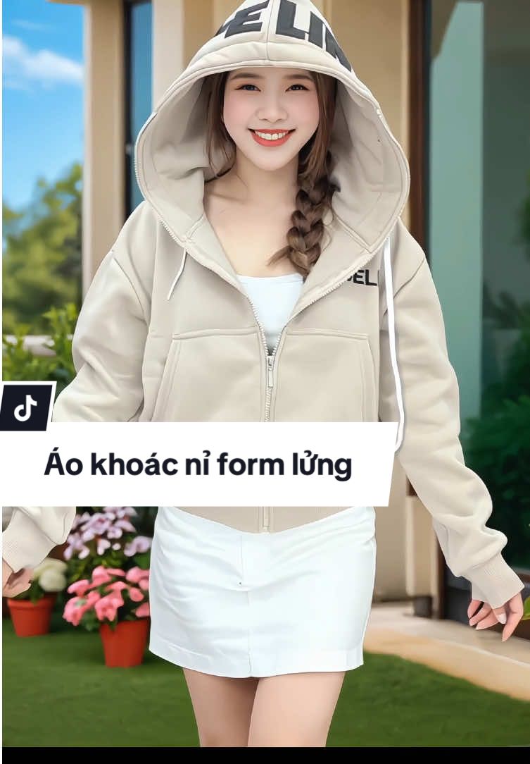 Áo khoác nỉ nữ với chất liệu nỉ bông dày dặn, mang lại sự thoải mái và ấm áp. Thiết kế form lửng năng động, phù hợp với phong cách thời trang hiện đại. Áo có nón to và tay xỏ ngón, cùng 4 túi rộng tiện lợi. Đây là item không thể thiếu cho tủ đồ mùa lạnh của bạn. #aokhoacni #aokhoacnu #aokhoactre #aokhoaclung #xuhuong 