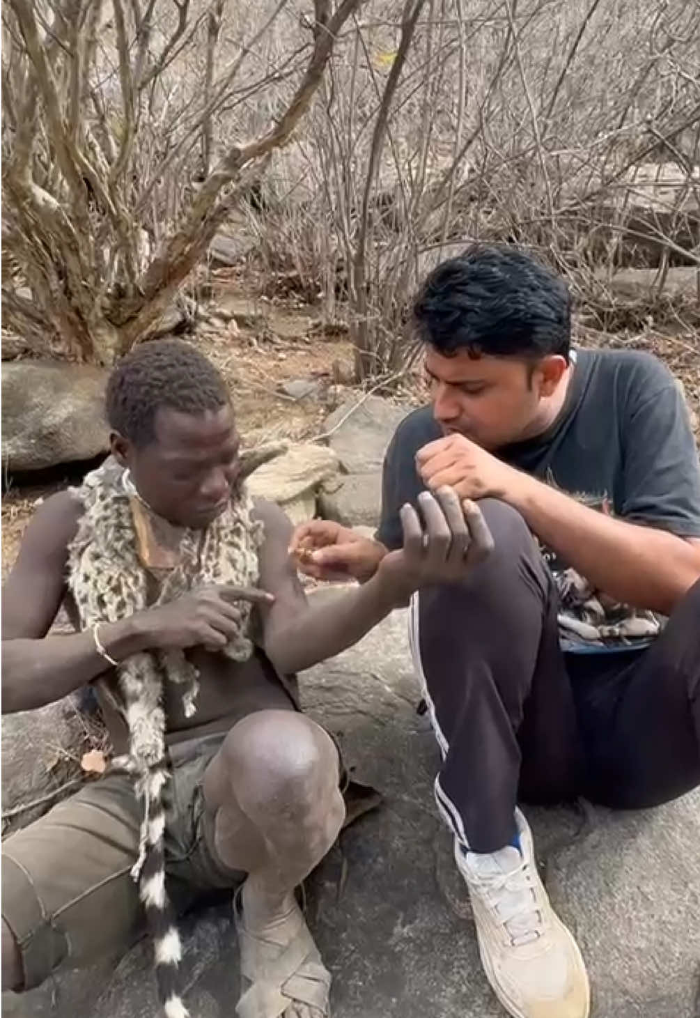 “Perfume magic in the jungle 🌸✨” I sprayed perfume on a Hadzabe hunter—his reaction was priceless 😇 He was surprised that such a sweet fragrance can come from a bottle instead of flowers 🌺💨 Loved how curious and happy he was, truly a first-time experience 🙌 👉 Full journey on YouTube 🎥 | Follow for more tribal life stories 🌍 #Hadzabe #TribalLife #FirstTimeExperience #culturetrip 