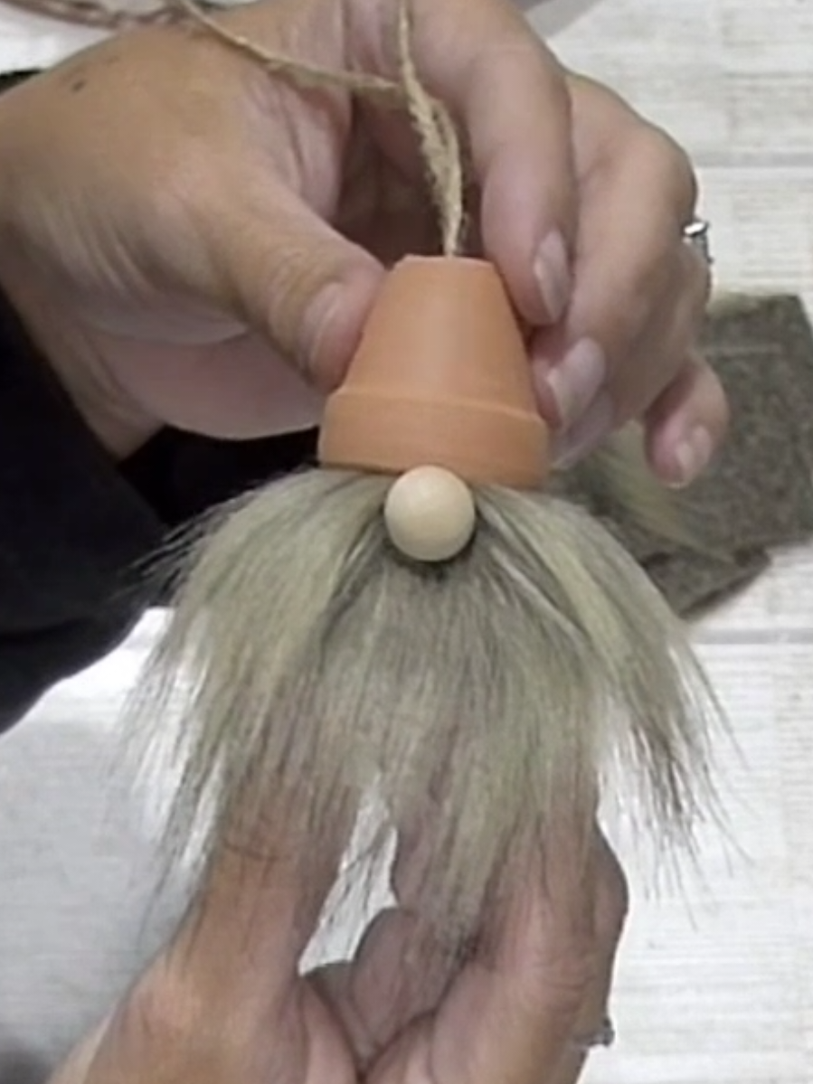 Here's how I make my gnome ornaments for holiday craft fairs. I think they are easy to pull together and customers usually love them!! I also make Santa gnomes with white beards and paint the little clay hats red. I even made grinchy ones last year with green beards. They're fun! If you make them and share a video, tag me so I can see it! I love seeing what you guys come up with!!  I'm making lots of things for my craft fair lately so follow me for more easy craft fair items to make and sell and other diy decor inspo! #handmadeornaments #diyornaments #gnomedecor #christmascrafts #holidaycrafts 