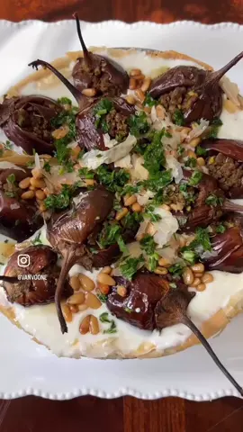 This dish is amazing!! 😋 - 1 lb small eggplants  Bake at 350F for 30-40 minutes or until cooked. Yogurt Mixture - 1 lbs fat free yogurt - 4 cloves of diced garlic - 2 tbsp tahini  - salt  Meat mixture: In a pan, stir fry 2 lbs ground beef with the following spices: - 1 tsp seven spices - 1 tsp turmeric  - 1 tsp black pepper - 1 tsp paprika  - salt (adjust to your liking) - 1 tsp garlic powder - add 3 cloves of diced garlic - add 1 diced onion - add 4 puréed tomatoes - add 3 tbsp pomegranate molasses  Brush a springform pan with avocado oil - place layers of phyllo dough (8 oz) in the pan. Brush the phyllo with avocado oil - bake at 350F for 15 minutes or until golden - add half the meat mixture over the phyllo dough  - stuff the eggplants with the meat mixture - pour the yogurt mixture over the meat - place the stuffed eggplants over the yogurt - add pine nuts (stir fry first) - garnish with parsley #mediterranean #mediterraneanfood #mediterraneandiet