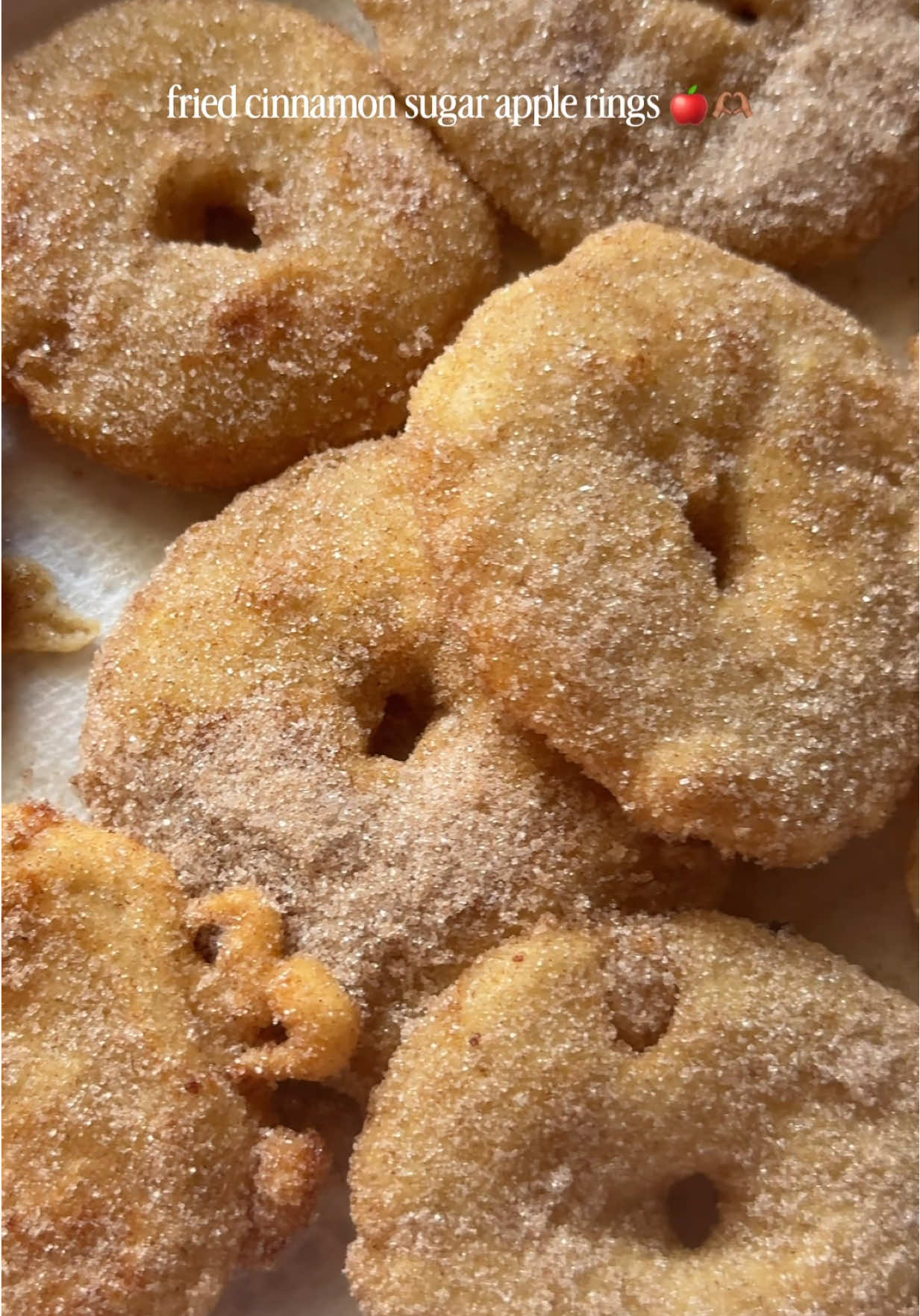 Fried Cinnamon Sugar Apple Rings 🍎  * 3 large apples, cut into rings * 1 cup all purpose flour * 3/4 cups milk * About 1/4 tsp ground cinnamon * Cinnamon sugar to coat, about 1/2 cup granulated sugar + 2 tsp cinnamon * Oil for frying Oil Temperature: 350F-365F (medium high heat) 1. Wash and cut your apples sideways into rings (about 1 inch circles). You can choose to peel or not peel your apples. 2. Make sure to cut the core out of the middle and also cut a circle using a knife. I used a piping tip to cut circles out. 3. Mix up your flour, milk, and cinnamon to make your frying batter. It should be consistency of pancake batter. Not too thin and not too thick. 4. Heat your oil to about 350F-365F (medium high heat). 5. While that’s warming up mix your cinnamon and sugar together. 6. Once your oil is hot enough, dip your apples in the batter and place into frying pan. Fry maybe four at a time so you don’t overcrowd your pan. 7. Make sure to have a plate with paper towel off to the side. 8. Fry for about 2-4 minutes until each side is a light golden brown (repeat with the rest of the apple rings). Take out of pan and place onto a plate with paper towel. 9. Once your apple rings are done toss them in your cinnamon sugar while still warm. 10. Dive into these cinnamon sugar apple rings that literally taste like a fried apple pie 🍎🫶🏽 #cinnamonsugarapplerings #friedapples #dessertrecipe #falldesserts #zeetheintrovert @Kroger @Beautiful By Drew 