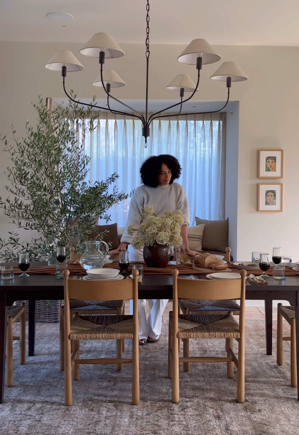 Set the table with us! Complete with handmade dinnerware and cozy, warm-toned linens. #falldinnerparty #falldecor #interiordesign