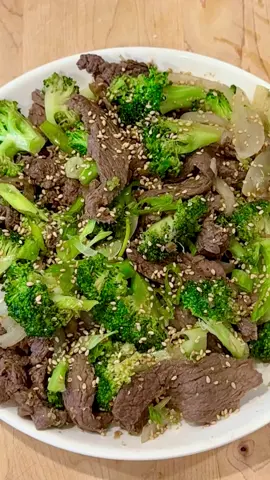 Easy Beef Broccoli Stir Fry made with bulgogi marinade. Ingredients * 1 pound beef tenderloin, flank or ribeye, thinly sliced * 1/4 onion, sliced  * 2-3 cups broccoli florets  * Optional: drizzle of sesame oil  * Optional garnish: sesame seeds or green onions  Marinade (adjust to taste)  * 1-2 Tablespoons sweetener  * 1/4 teaspoon black pepper * 4 Tablespoons soy sauce  * 2-3 cloves garlic,  minced or grated * 1/4 inch ginger, minced or grated  * ½ apple or pear, grated * 1 Tablespoon sesame oil Directions  In a bowl, mix together the sweetener, black pepper, soy sauce, garlic, ginger, and apple.  Combine the sliced beef with the marinade, then mix in the sesame oil. Set aside while you prep the remaining ingredients.  (To prep ahead: place in the fridge until ready to cook).  Heat beef in a large pan without oil and stir-fry for about 5 minutes. Add onion and broccoli, and stir-fry for a few minutes until the meat is cooked and the broccoli is tender. Taste and adjust seasonings as needed.  Optional: add sesame oil or garnish before serving.  #EasyRecipe #stirfry #weeknightdinner 