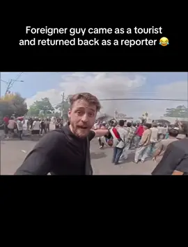 Foreigner guy came as a tourist but returned back as a reporter 😂he will never forget this moment 😂#genzprotest #viraltourist #foreginer #viral #tiktokviral 