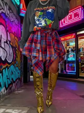 Street vibes on point 🔥 Plaid skirt + metallic boots = ultimate statement look! Would you rock this for your holiday night out? 🎄✨ #StreetStyle #HolidayOOTD #PlaidSkirt #EdgyLook #WinterFashion    