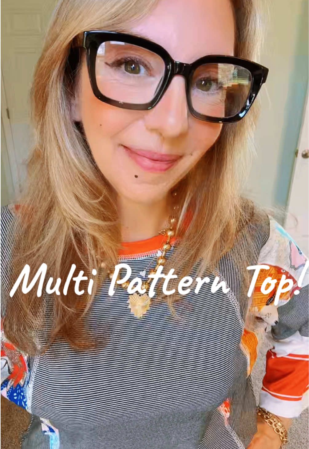 Make a statement in this three-quarter sleeve top featuring a bold striped bodice and vibrant patterned sleeves. Bright, eye-catching, and fun, it’s the perfect piece to add color and personality to your wardrobe while keeping you comfortable and stylish. #StatementTop #ColorfulVibes #EverydayChic #StripedAndStylish #PatternPlay