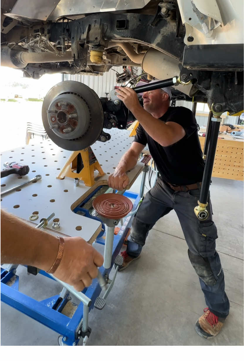 Work on the Gladiator in the @Toolgrid garage continues as @WayneDick and I get the @RockJock4x4 suspension components in, lift the beefed up axle with the @Artec Industries truss into place, install the @Falcon Shocks and swap out the stock diff cover for the much stronger @artecindustries diff cover and install the  @rockjock4x4 steady bearing spacer so we can hook the drive shaft back up with @Einhell Canada and @Milwaukee Tool  