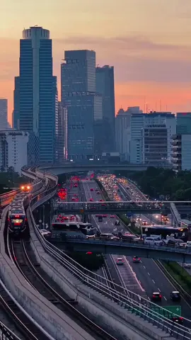 On the LRT tracks and rising towers, modernity meets the beauty of sunset #djiera #djiindonesia #explorejakarta #folkindonesia #jakartaselatan