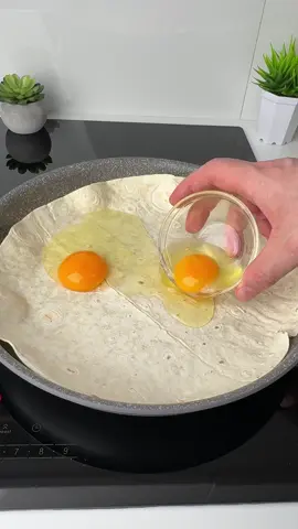 #VNVideoEditor                                       THE BEST WAY TO MAKE Tuna Tortilla Pie for Breakfast.                             Get Your DREAM Breakfast With This Easy Tuna Tortilla Pie Recipe INGREDIENTS: ●Flatbread - 2 pcs. ●Eggs - 2 pcs. ●Tomato - 1/2 pc. ●Onion - 1 pc. ●Canned tuna - 180 g ●Salt - 1 tsp. ●Black pepper - to taste. ●Parsley - 10 g ●Grated hard cheese - 100 g ●Butter - 10 g 1. Slice a small onion into thin strips and fry in vegetable oil until golden brown. 2. Place a tortilla in a greased frying pan. 3. Crack 2 eggs on top and mix with a fork. 4. Add finely chopped tomato, fried onion, and chopped tuna to the eggs. Season with salt and black pepper. While you're adding everything, cook over medium-low heat. 5. Sprinkle with parsley and grated cheese and top with a second tortilla. Press it lightly to seal the edges with the first. 6. Increase the heat slightly and cook for 1-2 minutes until the tortilla browns on the bottom. 7. Flip the pie over with a plate and cook for another 1-2 minutes on the other side. ●It's incredibly delicious and very simple!!!● Bon appetit! The recipe in your language is available in the description, 💖🇺🇦🇵🇱🇩🇪🇺🇸🇫🇰🇪🇸🇵🇹🇮🇹🇷🇴 🇷🇸🇭🇷🇱🇻🇸🇮🇨🇿🇫🇮🇸🇪🇩🇰🇳🇴 🇯🇵 🇬🇷 🇮🇱🇰🇿🇰🇬🇱🇻🇹🇼 🇵🇪 🇦🇷 🇨🇱 🇻🇪 🇹🇭 🇧🇷                       #breakfast #lavash #tortilla #simplydeliciousrecipes 
