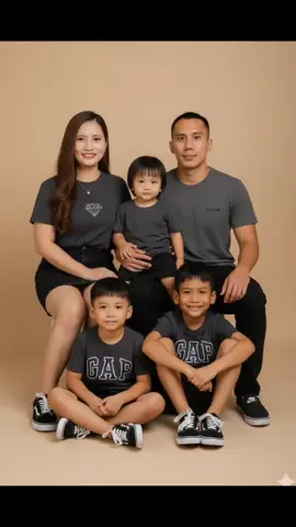Hi! I use Google Gemini and here's the prompt: Create a realistic family portrait of 3 people i a professional beige studio background. Dont change their face place the parents sitting on side. The man and boy wearing a dark grey Volcom Brand T-shirt wearing a shirt. The women wearing dark grey with diamond brand print and black denim skirt with small gold necklace and the boys wearing a dark grey GAP Brand tshirt and black short. The women and the boy wearing black vans era shoes with lace and the men wear wear black/white Nike brand slip on shoes