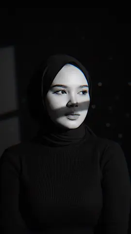 di ss trus ke googel trus salin ya guys 🙏🏻🤎#prompts #geminai #masukberandafypシ : a high resolution black and white portrait of a girl wearing a sharp black turtle neck and chic small gold earrings along with hijab modern. She stands confidently in minimal studio setting slightly to the side dramatic studio lighting creates bold geometric shadows on her face and background strong cross beams of light. Cut through the shadows her expression is calm introspective and slightly distant the image has cinematic, high quality nor tone with high contrast and fine detail on her face and suits texture soft brokeh background#pioneertemplate 