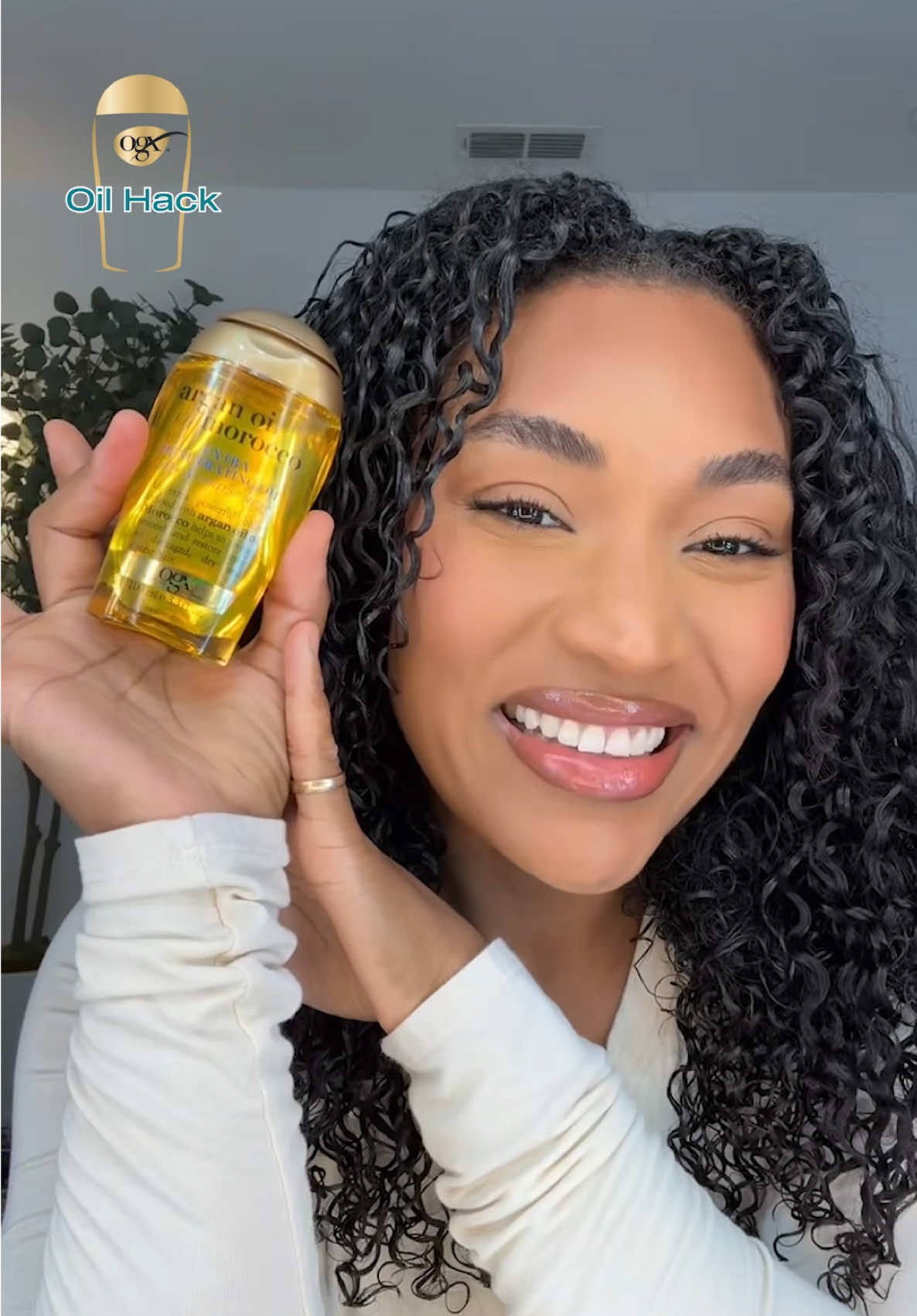 OIL HACK OF THE DAY: BREAKING THE CAST 🔓✨​ @Irisbeilin unlocks the hack to breaking your cast after wash day with our Renewing + Argan Oil of Morocco Extra Penetrating Oil. Goodbye crunch and hello volume! 👏​ Grab your bottle @Walmart! #OGXHairOilHacks
