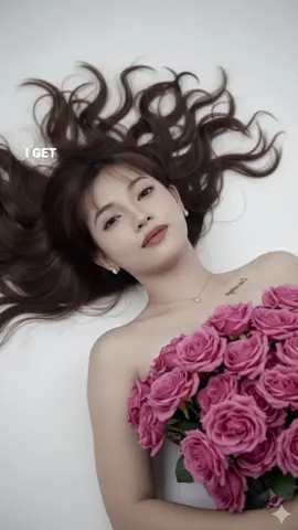 #CapCut #GeminiAiPrompt  Make me a studio portrait using my picture of a woman lying on her back, on the floor she has a bouquet of pink roses on her chest appearing as if the flowers were her top. Her hair is long and styled soft wavy spread out. She is wearing diamond earrings and a delicate gold necklace. She has a serene expression, with her head slightly tilted, and she gazes at the camera with a soft, inviting look. The image exudes elegance and beauty, with a touch of romance, as the roses serve as a striking focal point in the composition.
