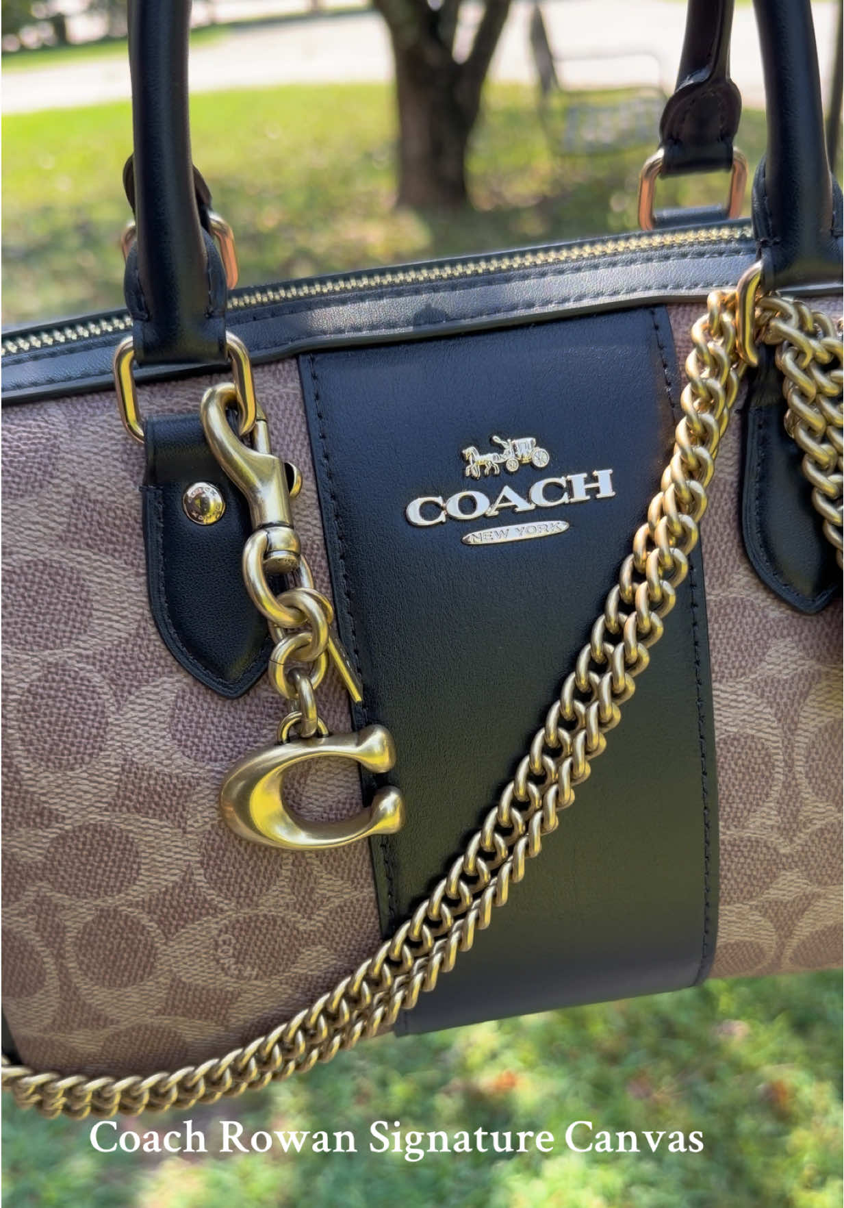 Coach Rowan (medium) in signature canvas.  This bag is SO much prettier in person. I decided to accessorize her today with my Coach dinky gold chain and my latest signature C Coach charm.  Easy and elegant! @Coach  #coachrowan #coachrowansatchel #coachsignature #coachbag #purseaccessories 