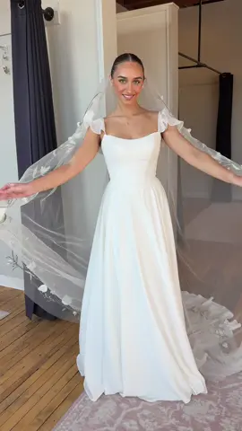 The soft whimsy bridal gown of our dreams 💫🌿🤍 Coraline is a soft crepe chiffon gown from WREN Bridal. The flutter sleeves are an add-on from our OTR accessory collection (but they can always be made!)  #weddingdressinspo #2026bride #bridetobe #weddingdress #whimsicalweddingdress soft bride, soft romantic wedding dress