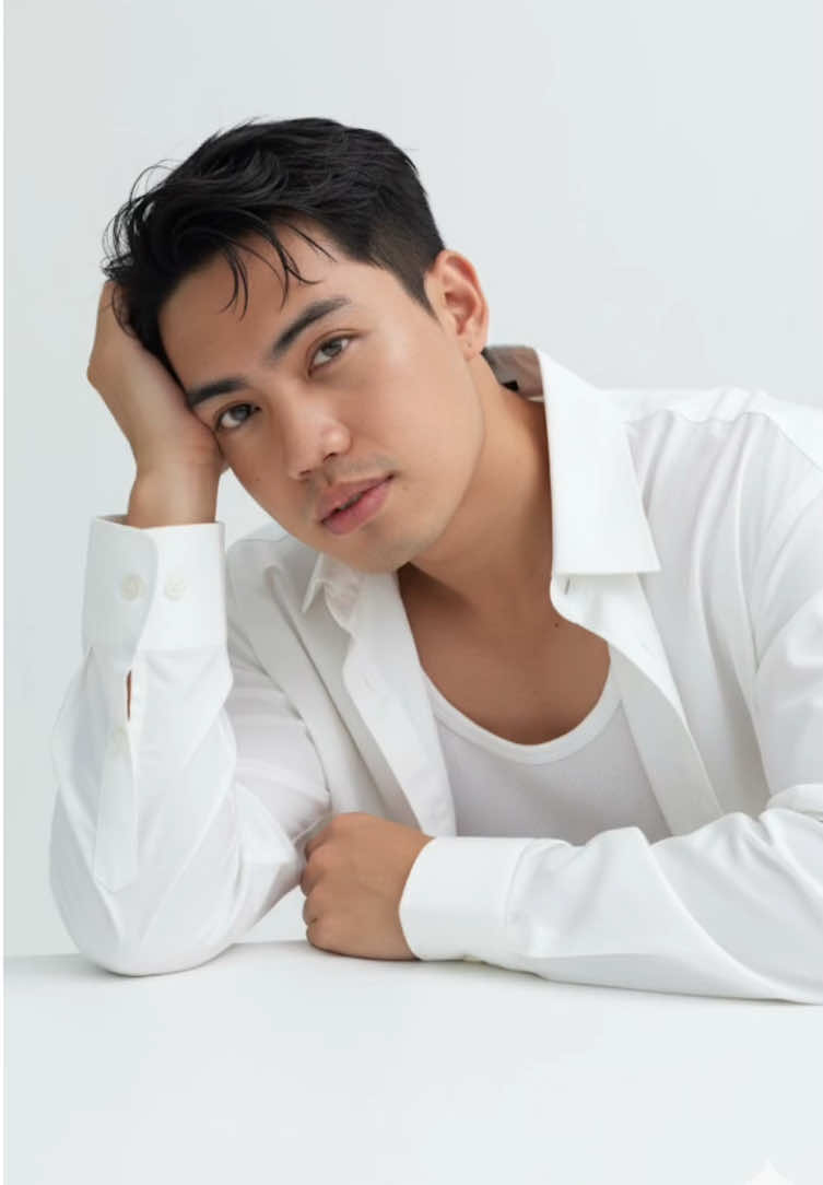 Step 1:Open your Gemini Ai Step 2:Upload Photo  Step 3:Copy the prompt  ➡️:Make a photoshoot closed-up of me in a studio against a plain, pure white backdrop. He wears a simple, oversize white shirt, giving off an elegant and minimalist vibe. His hair is korea styled that accentuates his facial features. Natural looking on his face no make up look , focusing on defined eyes, neat brows, The man poses with his head propped up on a white table, gazing at the camera with a soft alluring expression.and he only wears a white tank top with bit muscular body no blush just a even, face front view. Dont charge original face and hair. #geminiai #ai #fyp #makeitvirаl #trending #studio #photography #portrait 