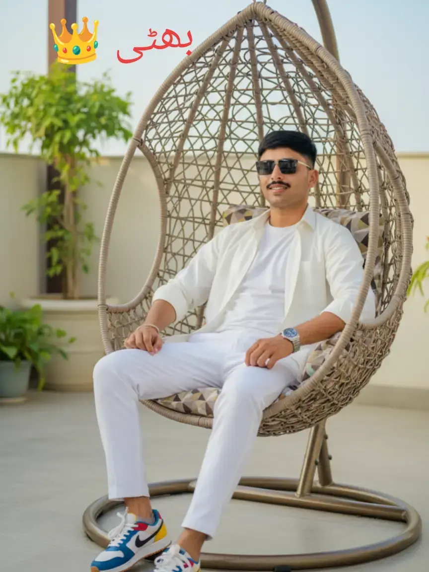 A hyper-realistic cinematic lifestyle portrait of a stylish young Indian man lounging confidently on a modern hanging wicker chair. He is dressed in a trendy all-white-ord set with a casual T-shirt and open shirt, paired with colorful designer sneakers and a luxury wristwatch. His expression is cool and composed as he slightly leans back with a relaxed posture, wearing dark sunglasses that add charisma to his look. The setting is a minimal outdoor terrace with subtle decor, soft natural daylight, and a clean modern vibe. Captured in ultra-detailed 8K resolution with sharp textures, natural skin tones, realistic shadows, and a premium fashion editorial aesthetic.