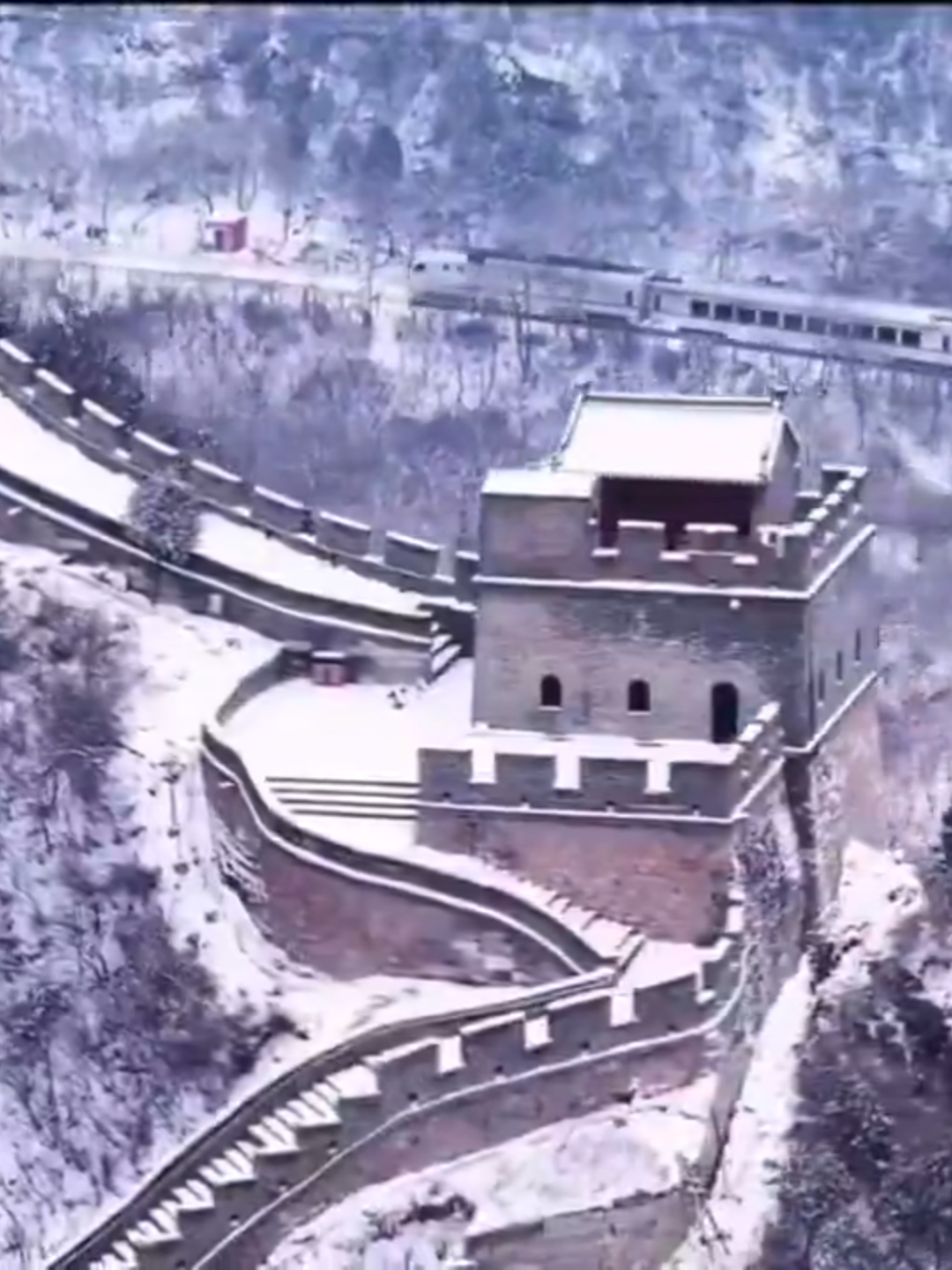 The Great Wall of China: from ancient defence structure to timeless symbol of peace.  It curves through spring blossoms, summer greens, autumn golds, and winter snows—visible even from the moon.