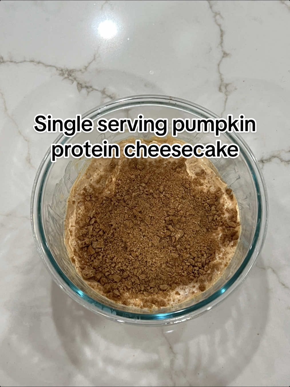 Single Serving Pumpkin Protein Cheesecake 🎃  -150g (a little less than 2/3 cup) nonfat plain Greek yogurt  -20g (about 2 tbs) whipped cream cheese -15g or half a scoop pumpkin (or vanilla) protein powder (can definitely increase this if you want to make this recipe even higher protein!) -50g (1/4-1/3 cup) canned pumpkin puree  -7g (about a tbs) sugar free cheesecake pudding mix -splash of vanilla extract & generous amount of pumpkin pie spice  Mix all well. In a small ziplock crush 6 Simple Mills sweet thin graham cookies with another shake of pumpkin pie spice & top on the cheesecake. Refrigerate for a few hours & enjoy! (I like to freeze for 1-2 hours before eating if I can!) Macros for my exact measurements including the graham topping:  291 calories  27.1g protein  7.4g fat 30.2g carb #pumpkinproteincheesecake #pumpkincheesecake #pumpkindessert #highproteindessert #macrofriendly 