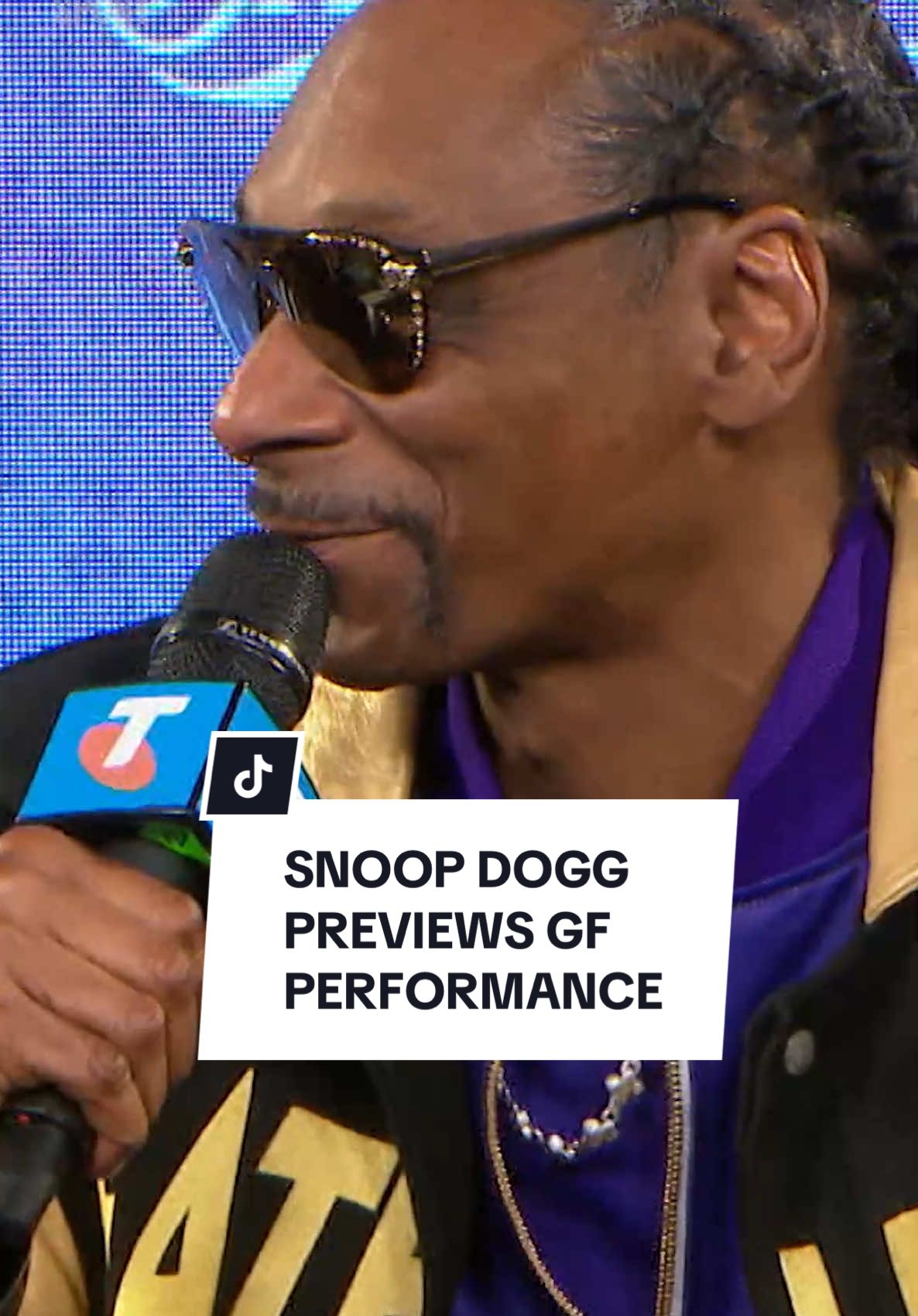 Snoop Dogg is refusing to pick a side ahead of Saturday's AFL Grand Final, presented with a pair of guernseys for the two teams to feature on Grand Final day, adorned with his name on the back. The U.S. superstar rapper hinting at some fun on stage as well as acknowledging an understanding of the magnitude the day holds in Australian culture. #snoopdogg #aflgf #10sport