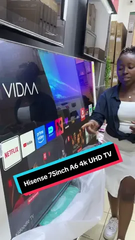 Hisense TV 75-inch 4K A6 Series UHD Smart TV features a 75-inch 4K Ultra HD (3840 x 2160) display with Dolby Vision and HDR10, a 60Hz panel, auto low latency mode, and variable refresh rate for gaming. It includes Chromecast Built-In, Google Assistant, and a voice remote for smart features. Connectivity options include 3 HDMI ports, 2 USB 2.0 ports, and Wi-Fi.   Display & Picture Quality  Display Size: 75-inch Resolution: 4K Ultra HD (3840 x 2160) HDR: Dolby Vision HDR and HDR10 Color: Wide Color Gamut is not available Backlight: Full Array FilmMaker Mode: Included AI Upscaler: Enhances non-4K content to near-4K quality Call/wassup 0715360022 #hisense #hisensesmarttv #hisensetv #smarttvbestprice 