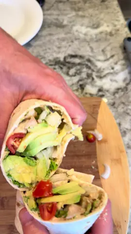 Chicken summer wrap- because who wants to lose summer!! Full recipe in description.                  Chicken Summer Wrap Ingredients For the Sandwich Spread:  * 1/2 cup light mayonnaise  * 1 tablespoon ketchup  * 1 teaspoon anchovy paste  * 1/2 cup grated Parmesan cheese  * 1/2 tablespoon dill relish  * 1 teaspoon Worcestershire sauce  * 1 teaspoon lemon juice For the Wraps:  * 10 cherry tomatoes  * 1/4 cup diced sweet Vidalia onions  * 1 avocado  * 2 chicken breasts, cubed  * 1 cup shredded iceberg lettuce  * 8-inch tortillas Instructions 1. Make the Sandwich Spread: Combine the mayonnaise, ketchup, anchovy paste, Parmesan cheese, dill relish, Worcestershire sauce, and lemon juice in a mini food processor or bowl. Whisk or beat until thoroughly combined. 2. Assemble the Wraps: Warm an 8-inch tortilla in the microwave for 5 to 10 seconds. Smear the warmed tortilla with the sandwich spread. Add the cherry tomatoes, diced sweet Vidalia onions, avocado, cubed chicken, and shredded iceberg lettuce. Roll the tortilla tightly. #chicken #wrap #Dinner #Recipe #Caesar      