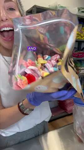 Peep the little blue gloved hands 👀🤭🥲😂 #rubybond #candy #halloweencandy #gummycandy #candyshop 
