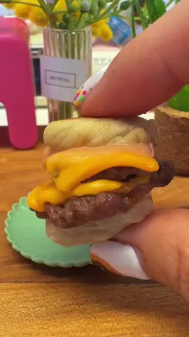 I shrunk the viral Dubai Smash Burger in the Mini Bakes Kitchen 🍔✨ Tiny buns made from scratch with flour, ghee, milk + a touch of spice 🥯🔥. Whipped up a creamy burger sauce with mayo, ketchup, mustard & hot sauce, then smashed juicy seasoned beef on the grill 👩‍🍳💛. Bite-sized, but full of flavor — the ultimate miniature smash burger! 🌍🍔 Would you try this tiny version of Dubai’s favorite burger? 👀👇 #MiniBakes #MiniatureFood #DubaiSmashBurger #FoodieDubai       #creatorsearchinsights 