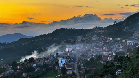 “Golden sky, peaceful vibes, and the Himalayas watching over 🌄”#gorkhanepal🇳🇵 #sunset #visitgorkha 