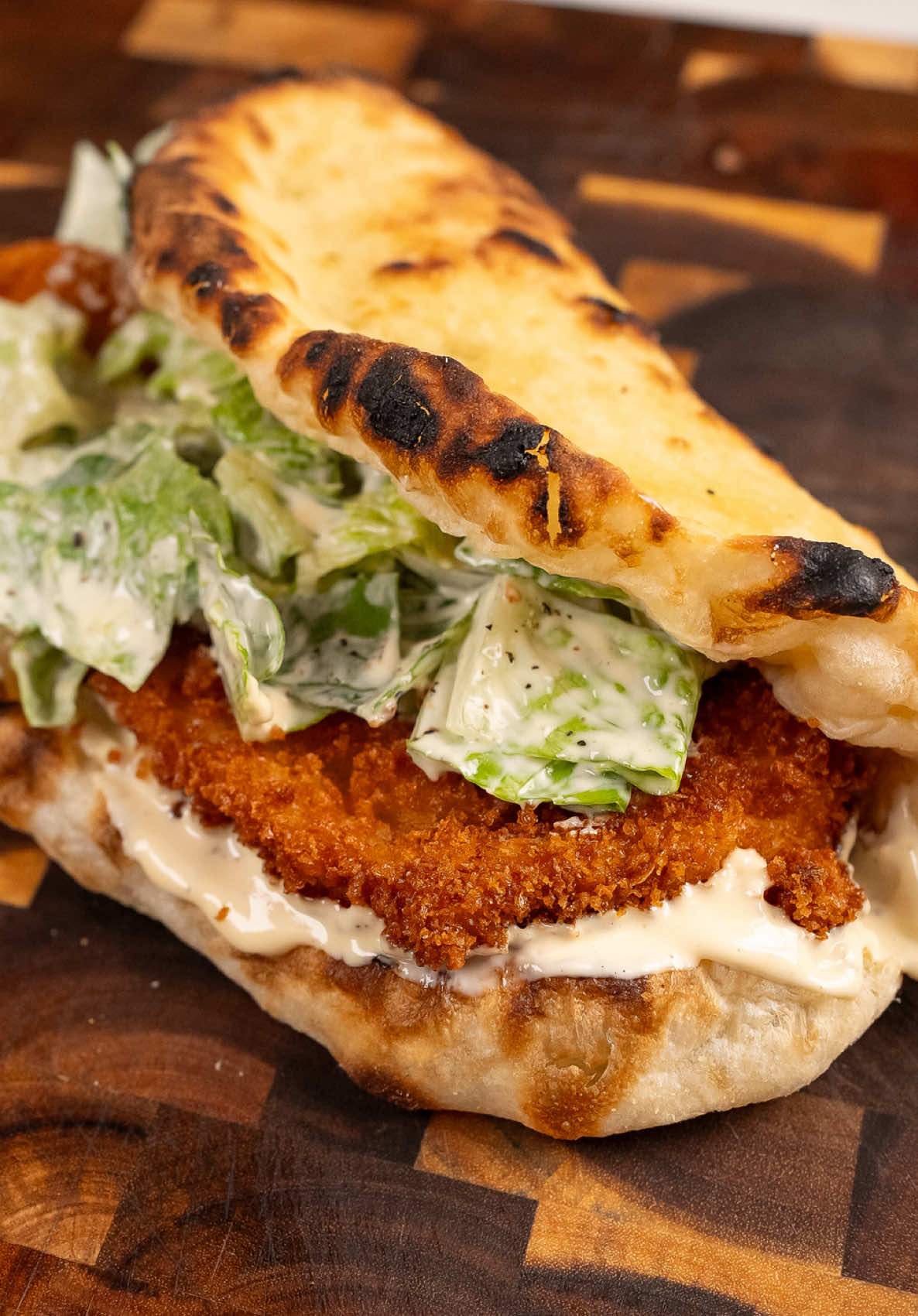 Crispy Chicken Caesar Pizza Sandwich Caesar salad and crispy chicken is a combo that’s hard to beat. Stuff it all inside folded pizza dough and it goes to another level. I used the Caesar dressing as the base of the sandwich, and together it made a heavenly bite. Full recipe on my website! #chickensandwich #foodieheaven #pizzalovers #fypp #EasyRecipe  crispy chicken sandwich chicken caesar pizza Easy recipe Easy comfort food American fusion food